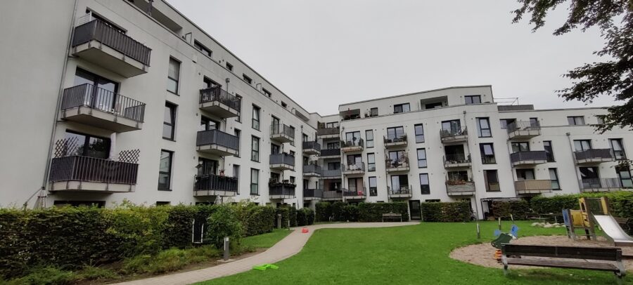 Neubauwhg. mit einem sonnigen Balkon in ruhiger Hinterhoflage! - Rückansicht